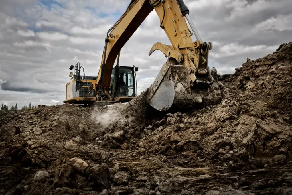 excavator digging into the ground with its large b 2025 02 09 20 08 19 utc